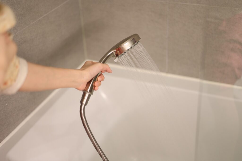 Why is Water Coming Out of the Shower Head While Filling Bathtub?